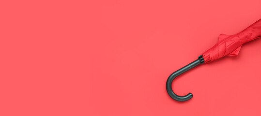 Red stylish umbrella on color background