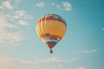 Fototapeta premium A stunning hot-air balloon shines brightly against the early morning sky, creating a captivating and colorful spectacle that embodies adventure and serenity.