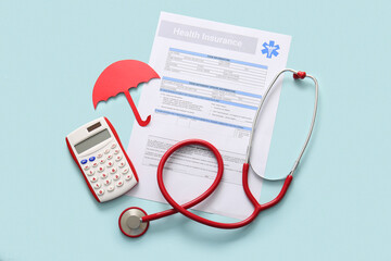 Health insurance form, calculator and stethoscope on light blue background