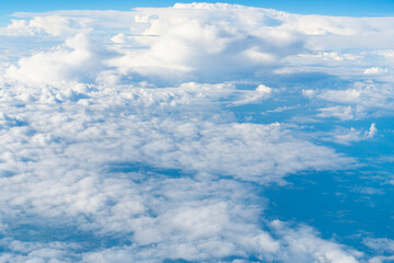 blue sky with a few clouds. The sky is very bright and the clouds are scattered throughout. Beautiful cloud in blue sky. White fluffy clouds in the sky.