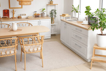 Interior of modern kitchen with dining table