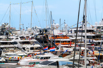 Luxury yachts packed together tightly as they party during a race weekend at Port Hercules marina...