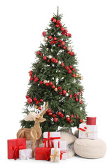 Beautiful Christmas tree with gifts, wooden deer and pouf on white background