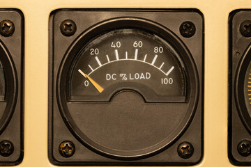 DC Load Meter, an instrument in an aircraft flight deck. A needle displays the percent of DC power...