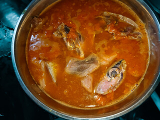 close up of a bowl of spicy and sour tuna fish sauce that has not been cooked