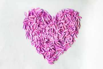 pieces of purple flower petals in the shape of a heart