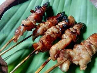 Chicken satay is a typical Indonesian food, tender chicken meat is cut into cubes then skewered and grilled over charcoal.