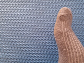 Close up of legs in socks. Sports gray socks