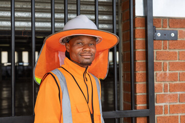 african man worker outdoors wearing Sunshade Hard Hat Full Brim Neck Sun Shade with Reflective Strip