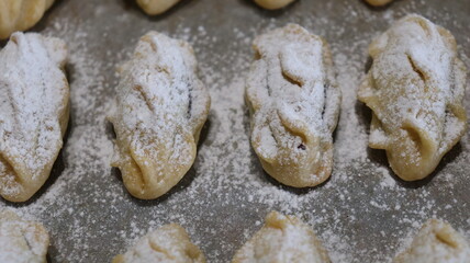 raditional Moroccan Mooncakes with Intricate Floral Pattern on Baking Sheet – Close-Up of Handmade Festival Cakes, Authentic Pastry Design, and Cultural Delicacies for Special Occasions