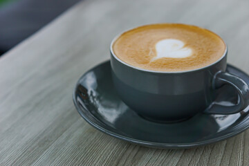 A cozy cup of coffee with a heart design on top, perfect for any coffee lover.