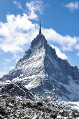 Majestic Snow-Capped Mountain Peak Against a Clear Blue Sky