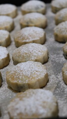 raditional Moroccan Mooncakes with Intricate Floral Pattern on Baking Sheet – Close-Up of Handmade Festival Cakes, Authentic Pastry Design, and Cultural Delicacies for Special Occasions