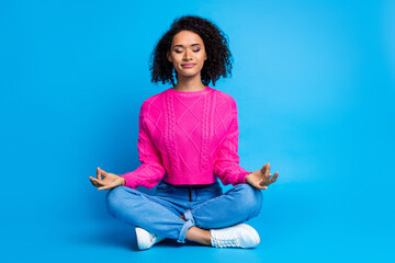 Full body photo of attractive young woman meditate gesture dressed stylish pink clothes isolated on...