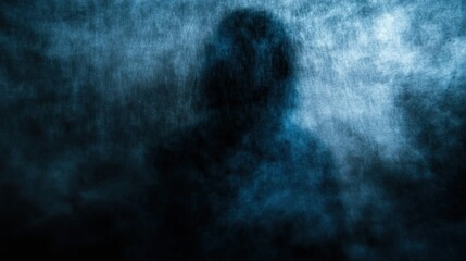 Obraz premium A shadowy figure emerges from a foggy, blue-toned background, creating a mysterious atmosphere.