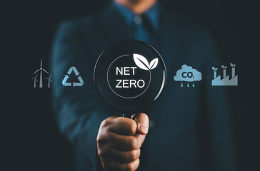 Sustainable development and green business concept, Businessman with net zero icons to change...