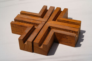 Isolated wooden elbows in the shape of a plus symbol. Piece of wood isolated on white background. Furniture Industry. Isolated objects. White Backgrounds. Graphic Resources