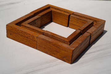 Isolated wooden elbows arranged in a box shape. Piece of wood isolated on white background. Furniture Industry.