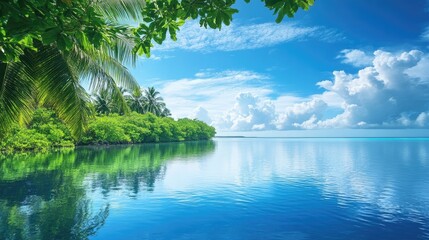 Obraz premium Tranquil waters mirror the bright blue sky and verdant vegetation enveloping an idyllic tropical beach