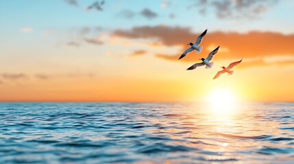 Fototapeta premium A flock of birds gracefully soaring towards a vibrant sunrise over a calm expansive ocean horizon symbolizing freedom new journeys and hope for the future