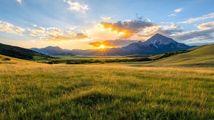 Obraz premium Stunning mountain landscape at sunrise with warm golden light breaking through dramatic clouds symbolizing hope and new beginnings for a fresh start Serene and peaceful rural outdoor scene