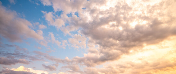 Sunrise sky background. Dramatic scenery sunset. Sky with clouds in Sunrise sky light background. Sunrise with clouds in various shapes. Calm Sunrise sky and sun through clouds over.