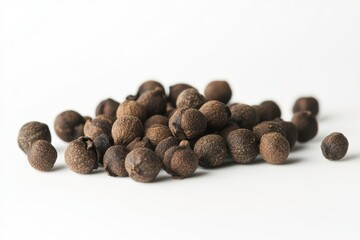 Close-up of Brown Spice Seeds on White Background