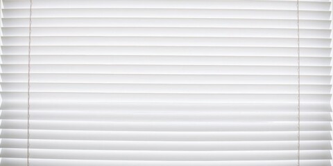 Fototapeta premium A close-up shot of a window covered by a white blind, allowing light to filter through the slats, shade, element