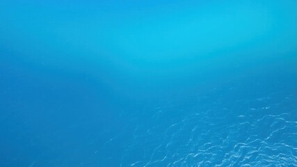 Obraz premium A breathtaking aerial view of the vast blue ocean with gentle waves, revealing a stunning gradient of deep navy to aquamarine hues, horizon, beauty