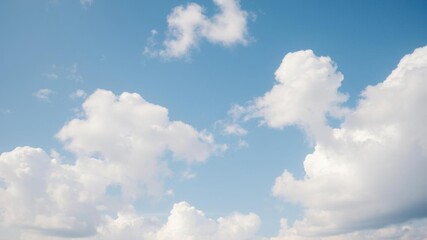 Obraz premium A serene image of a picturesque sky filled with fluffy white clouds, creating a peaceful and dreamy atmosphere, tranquil, blue