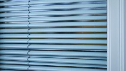 A close-up shot of a closed blind window, decor, privacy