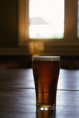 Single half pint of craft beer on a bar