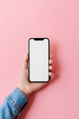 hand holding phone with white screen isolated on pink background mockup