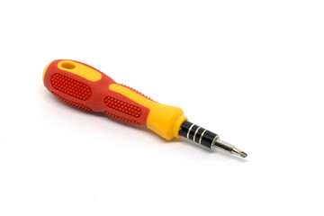 This image features a red and yellow screwdriver with an interchangeable head, ideal for versatile repair tasks. The tool rests against a plain white backdrop, highlighting its ergonomic design.