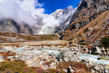 Rugged trail rises over rocky glacial terrain following the Hinku river up to Khare village on route to the  Base camp of Mera Peak,a 6476 meter high peak in the Khumbu Himalayas,Nepal