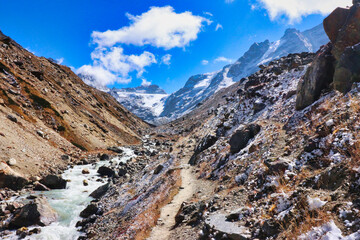Rugged trail rises over rocky glacial terrain following the Hinku river up to Khare village on route to the  Base camp of Mera Peak,a 6476 meter high peak in the Khumbu Himalayas,Nepal