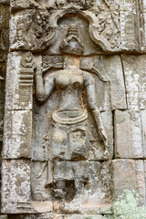 Bas-relief Sculpture of apsara dance at Ta Prohm temple, Siem Reap, Cambodia.