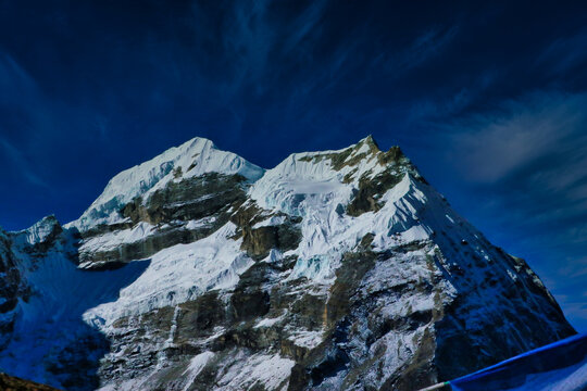 Mera Peak - View of North Summit,6476 meters on right and Central summit,6461 meters on left towering over the lodges in Khare village seen on a bright October morning in Himalayas,Nepal 