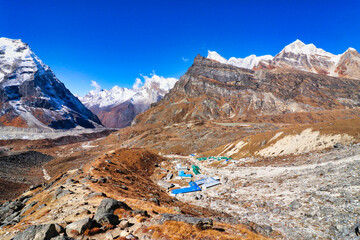 Picturesque wide angle view of Khare village,5041 m at the head of Hinku river valley with Kusum...