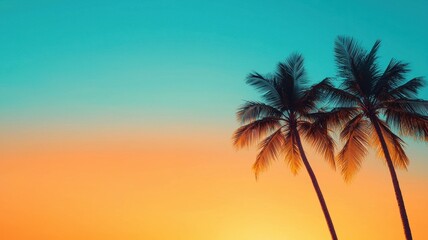 Obraz premium A serene sunset view featuring two palm trees silhouetted against a vibrant blue and orange sky, evoking a tropical atmosphere.