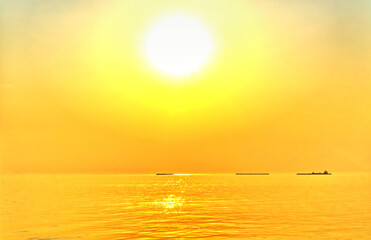 landscape,The beautiful yellow sky in the evening after sunset reflects the sea.