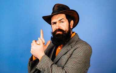 Beard and moustache. Old fashioned cowboy with long beard in cowboy hat. American bearded cowboys. Portrait of bearded man wearing cowboy hat. Cowboys style. Bearded Retro cowboy. Barber shop.