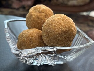 Exclusive shots of rare kerala traditional desert known as ari unda or rice laddu