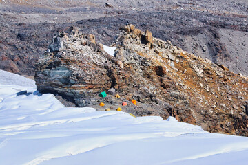 Mera Peak High Camp expedition tents and mess tents sheltered under a large rock off the Mera...