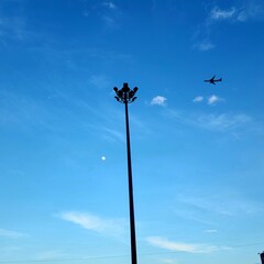 lamp post against blue sky