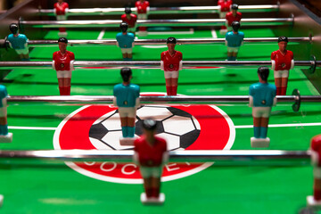 table football game on field, green and red, table game for 2 or more people