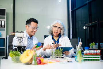 Team of scientists examining food samples in a lab with microscopes. Perfect for themes of food science, biotechnology,