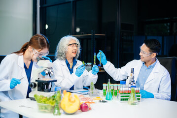 Team of scientists examining food samples in a lab with microscopes. Perfect for themes of food science, biotechnology,