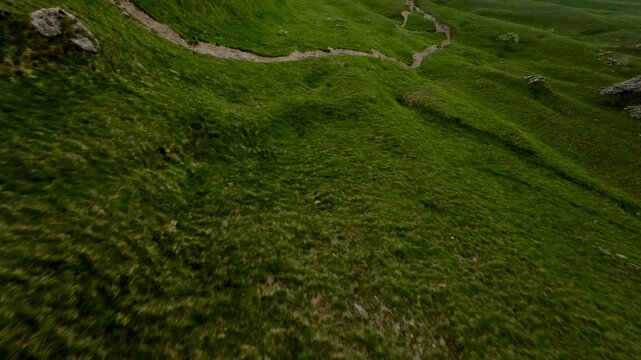 Grignetta Mountain in summer season, green meadows, Italian Alps, Aerial drone fpv