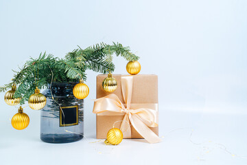 Christmas tree with golden balls close-up. New Year, Merry Christmas. Gift with golden bow